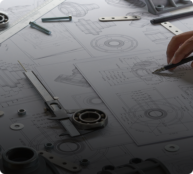 Drafting tools and mechanical drawings on table